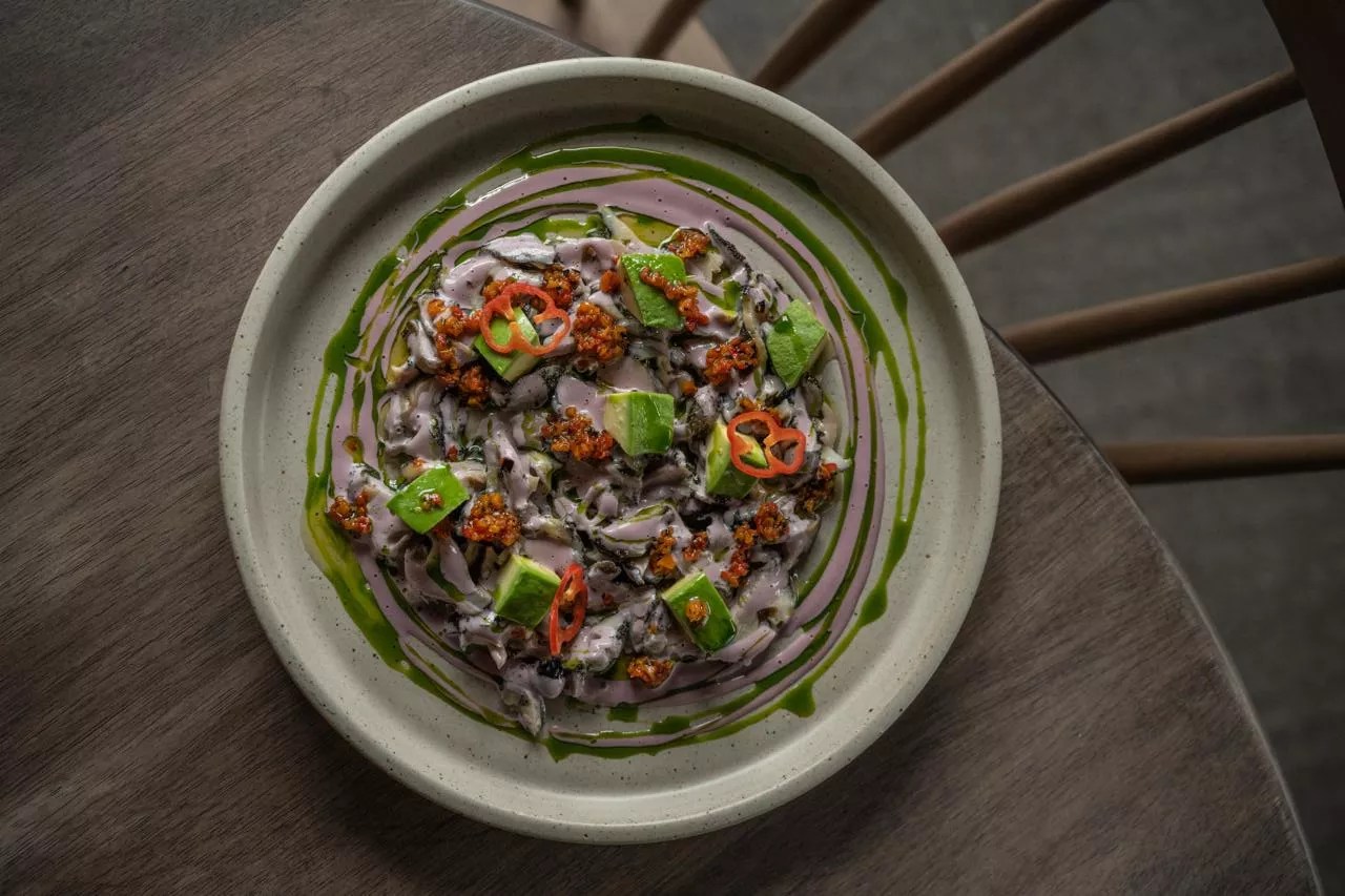clam dish on a plate with sauces