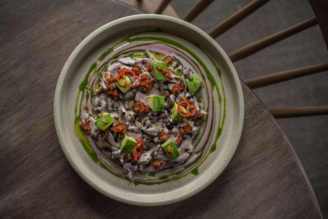 clam dish on a plate with sauces